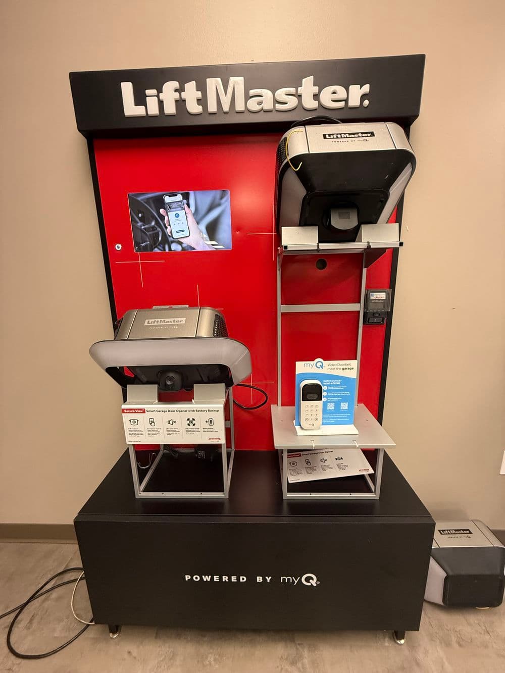 LiftMaster garage door openers display with myQ technology and product information.