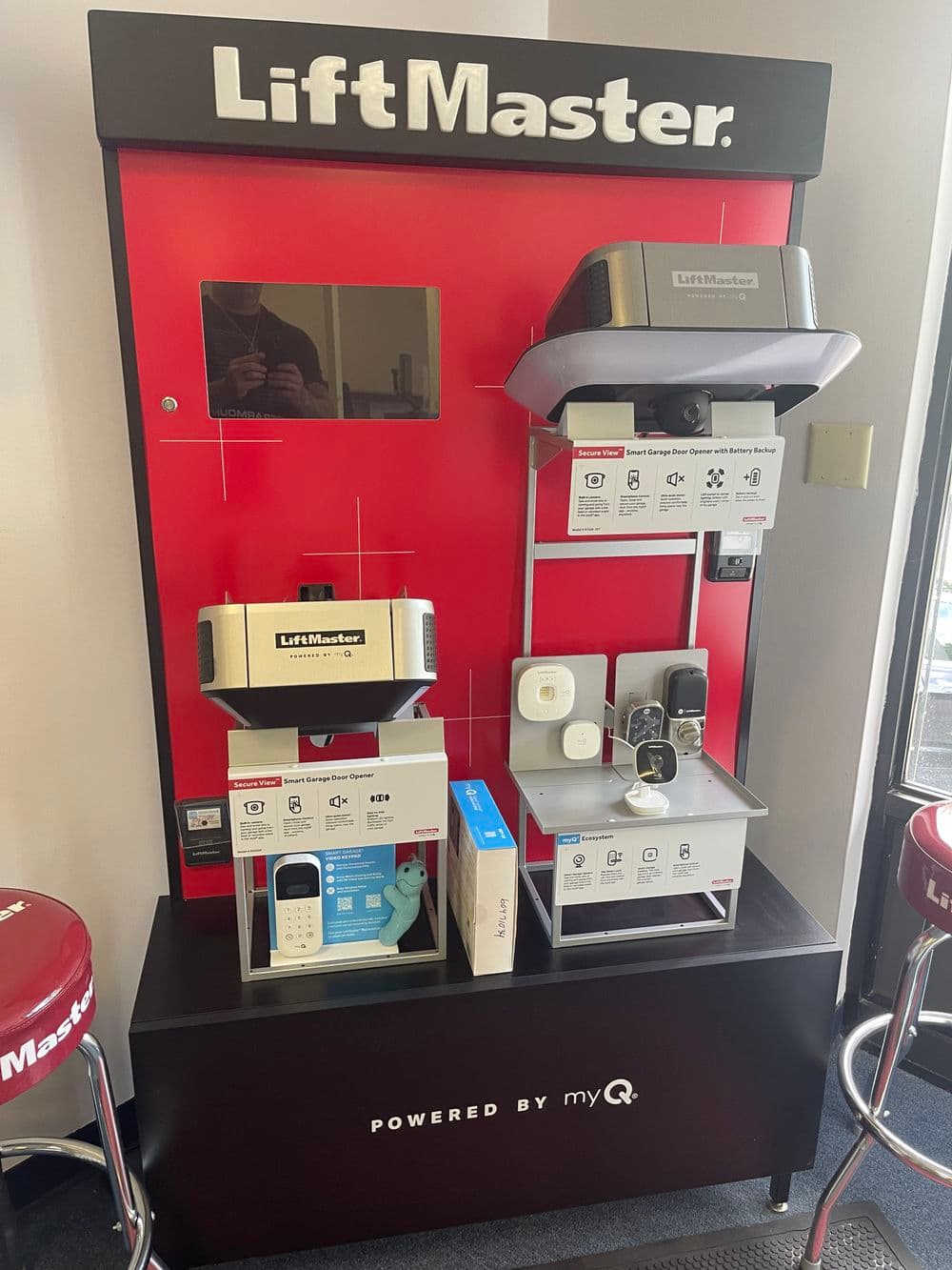 LiftMaster garage door opener display with myQ technology and product details.